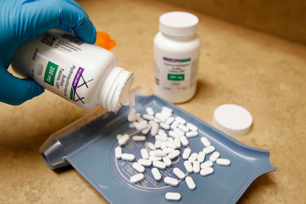 PHOTO:A pharmacy tech pours out pills of Hydroxychloroquine at Rock Canyon Pharmacy in Provo, Utah, on May 20, 2020.