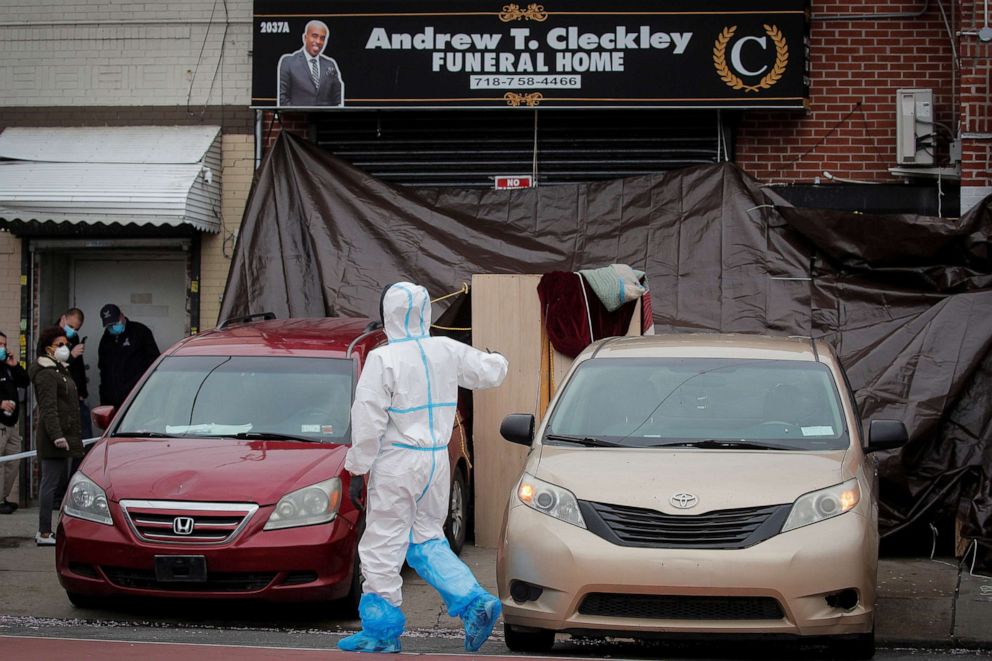 PHOTO: Workers are seen outside the Andrew T. Cleckley Funeral Services funeral home in Brooklyn, N.Y., April 30, 2020.