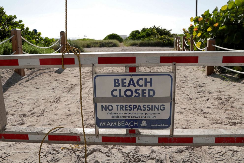 PHOTO:A sign is posted at a closed entrance to the beach during the new coronavirus pandemic, July 3, 2020, in  Miami Beach, Fla.
