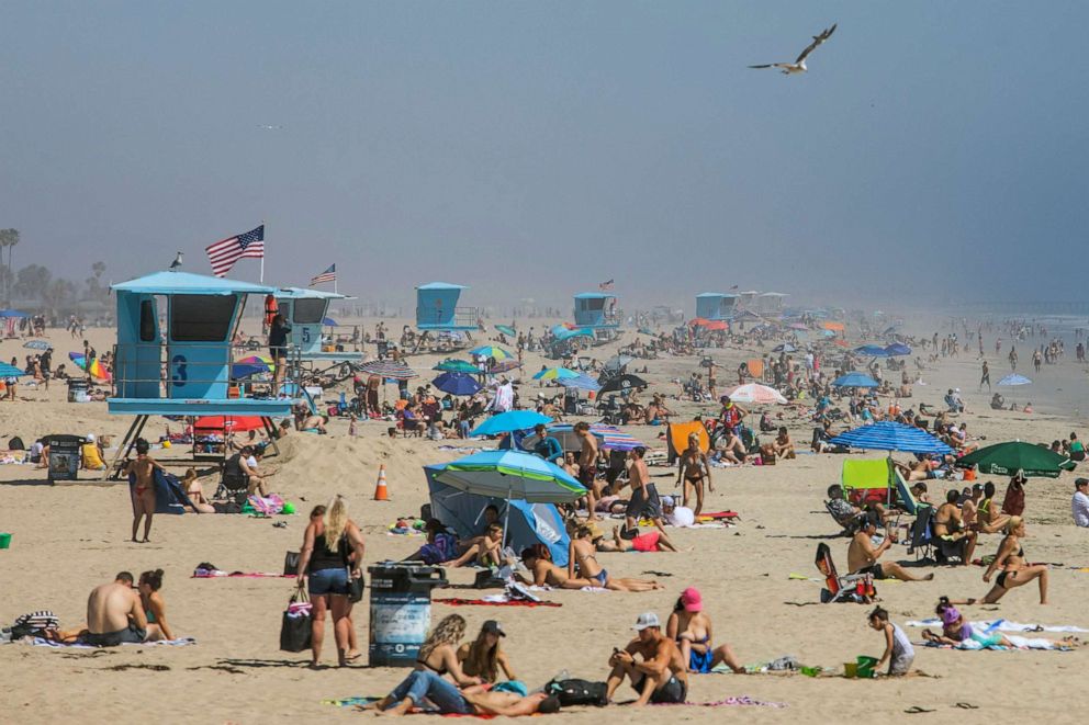 PHOTO: People enjoy the beach amid the novel coronavirus pandemic in Huntington Beach, Calif., April 25, 2020.