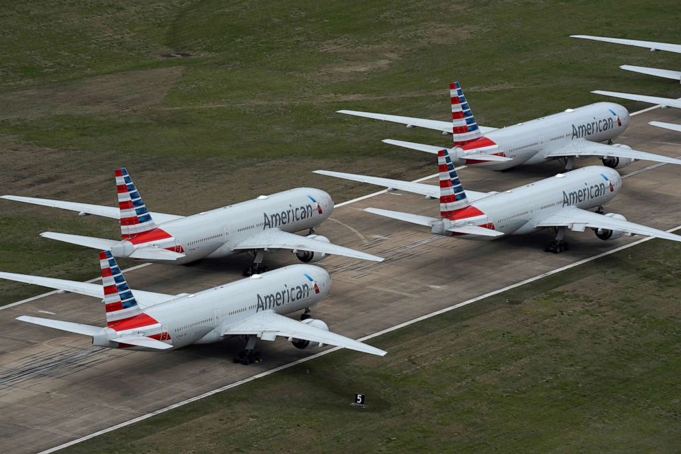 PHOTO: American Airlines passenger planes crowd a runway where they are parked due to flight reductions to slow the spread of coronavirus disease (COVID-19), at Tulsa International Airport in Tulsa, Ok., March 23, 2020.