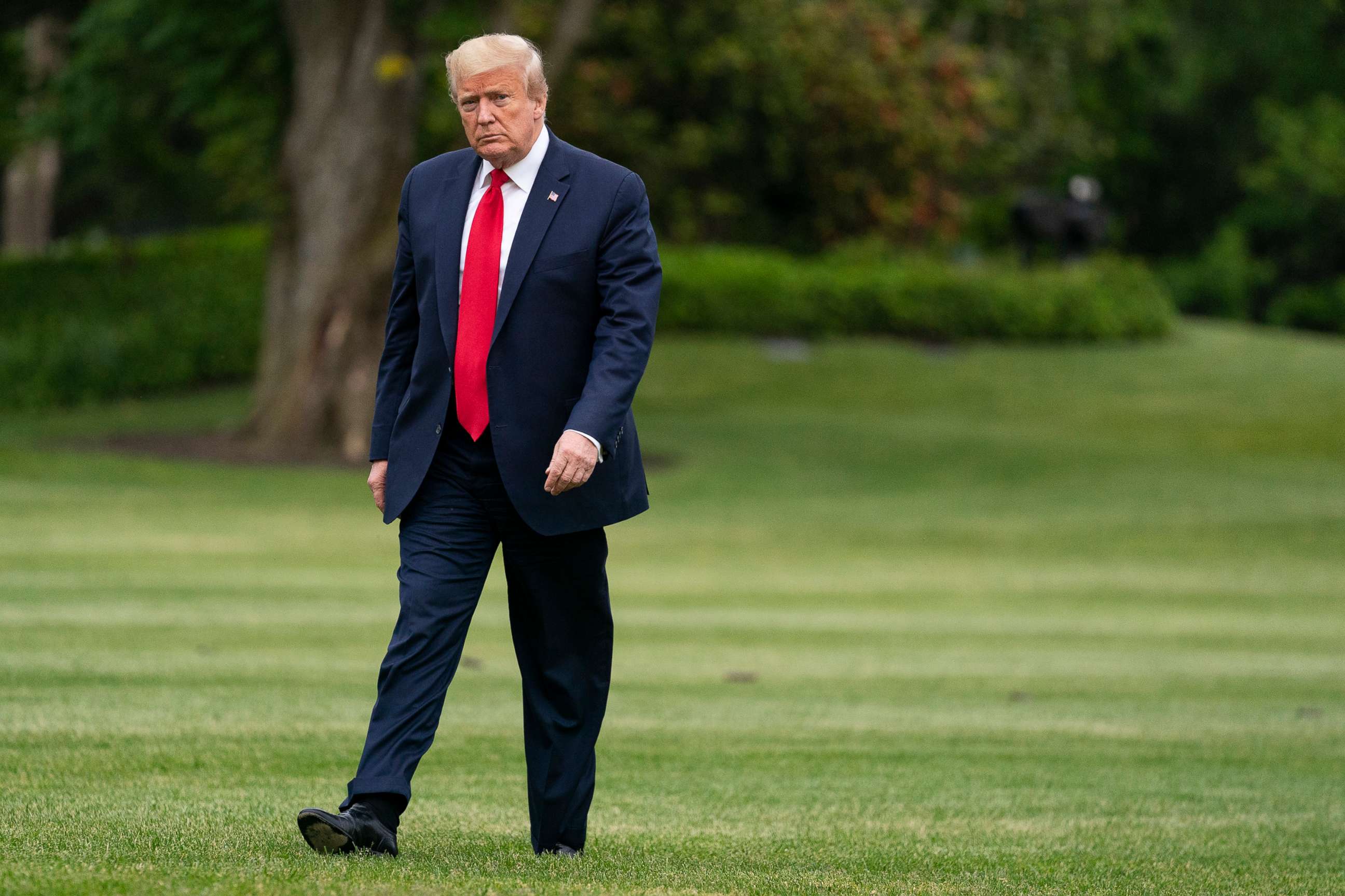 PHOTO: President Donald Trump arrives on the South Lawn of the White House after returning from a trip to Michigan, May 21, 2020, in Washington.