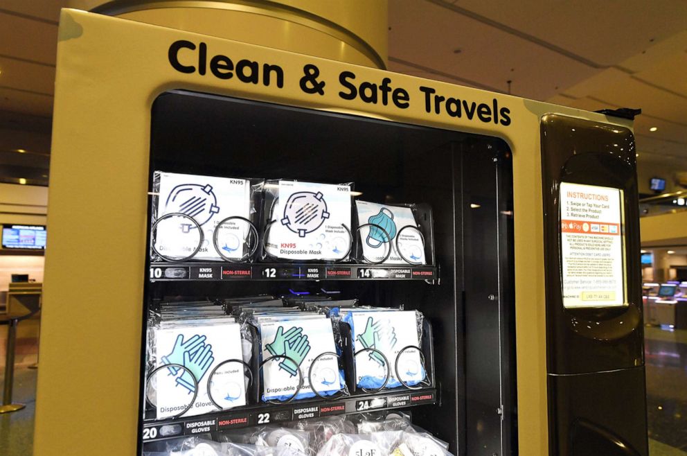 PHOTO: Masks and gloves are displayed in a personal protective equipment vending machine in the Terminal 1 ticketing area at McCarran International Airport on May 14, 2020 in Las Vegas.