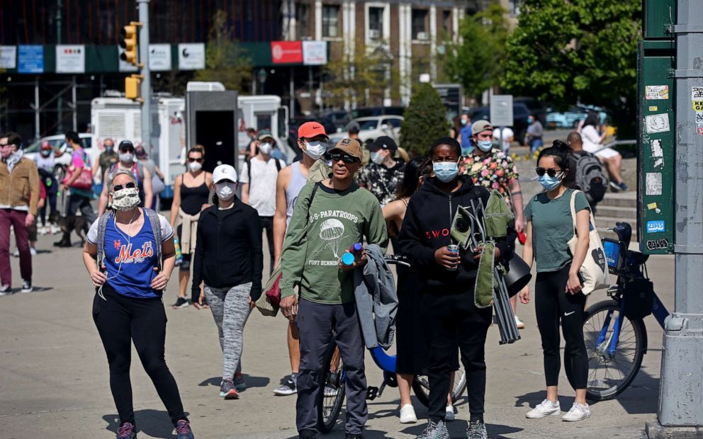 PHOTO: New Yorkers walk in front of Brooklyn Public Library during nice weekend weather as social distancing guidelines remain in place to limit the spread of coronavirus on May 2, 2020 in New York City.