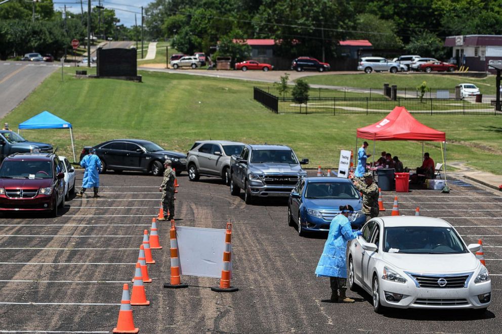 PHOTO: Members of the Mississippi Army National Gaurd host drive thru testing at J.L. King Senior Memorial Park Coronavirus drive thru testing, Starkville, Miss., June 22, 2020.