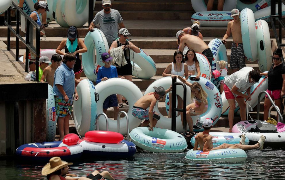 PHOTO: Tubers prepare to float the Comal River despite the recent spike in COVID-19 cases, June 25, 2020, in New Braunfels, Texas.