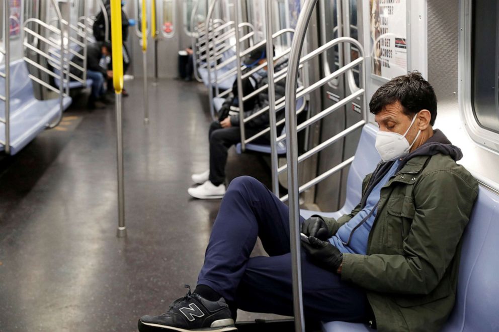 PHOTO: A commuter wears a mask while riding the New York City Subway as the outbreak of the coronavirus disease (COVID-19) continues in New York, April 30, 2020.