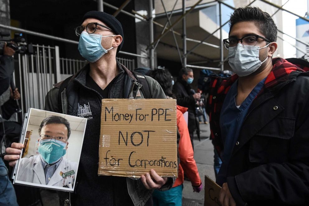 PHOTO: Mt. Sinai medical workers hold up photos of medical workers who have died from the coronavirus during a protest on April 3, 2020 in New York City.