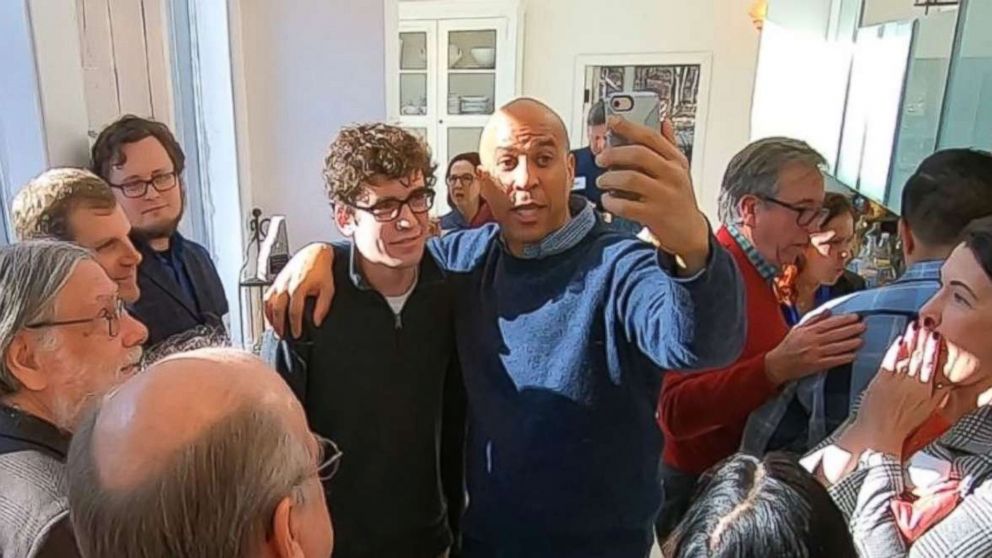 PHOTO: Sen. Cory Booker, D-N.J., poses for a photo at a house party in Nashua, N.H., as he tested the waters for a presidential run on Saturday, Dec. 8, 2018.