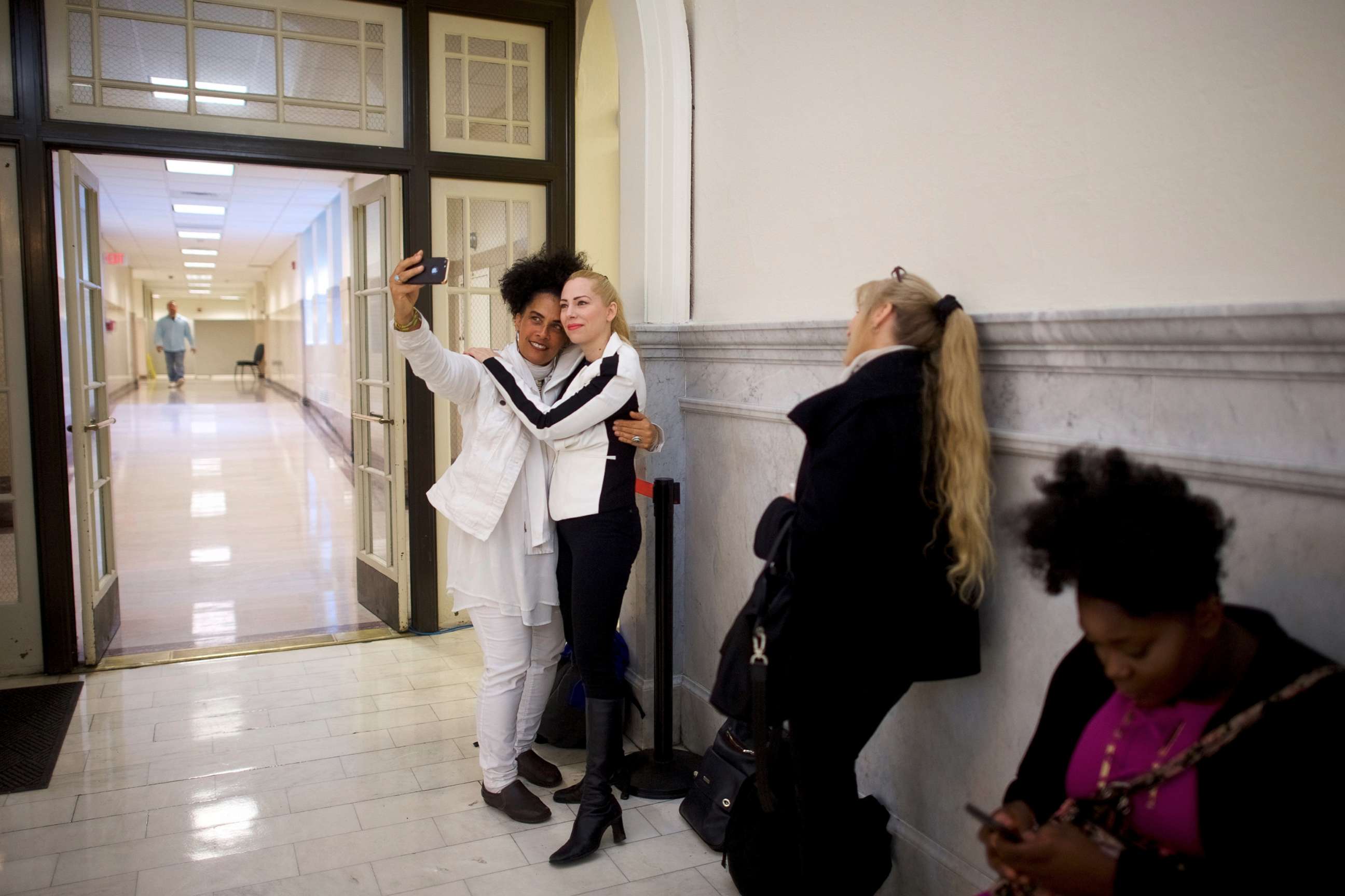 PHOTO: Bill Cosby accusers Lili Bernard and Caroline Heldman pose for a selfie while waiting in line before the courtroom opens at the Montgomery County Courthouse in Norristown, Pa., April 26, 2018.