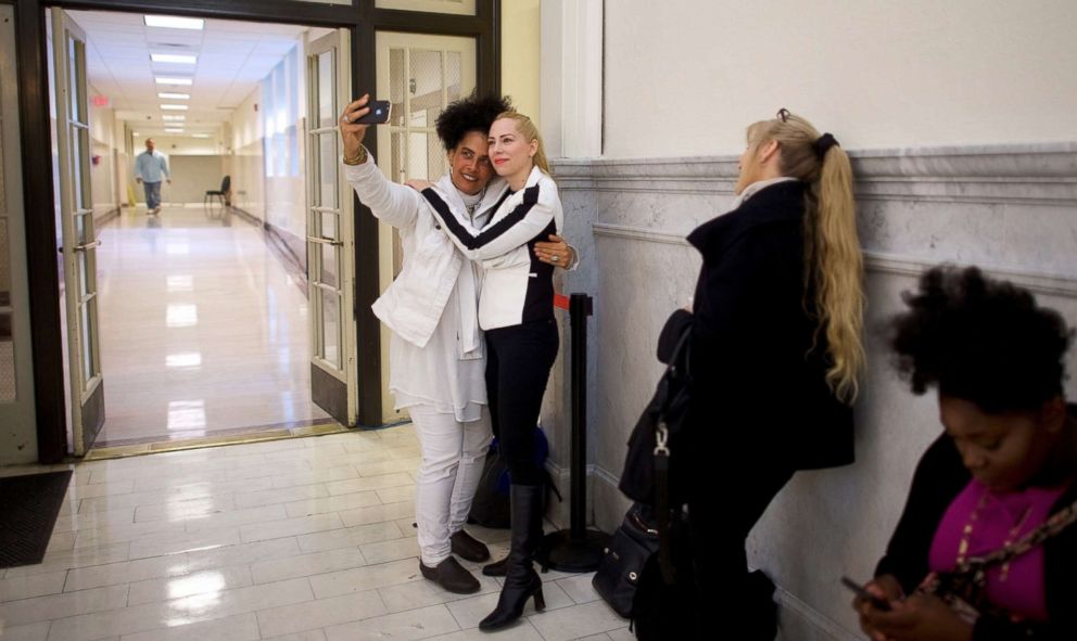 PHOTO: Bill Cosby accusers Lili Bernard and Caroline Heldman pose for a selfie while waiting in line before the courtroom opens at the Montgomery County Courthouse in Norristown, Pa., April 26, 2018.