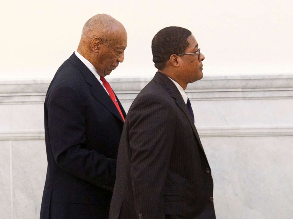 PHOTO: Bill Cosby walks through the Montgomery County Courthouse with his publicist, Andrew Wyatt, after being found guilty on all counts in his sexual assault retrial, April 26, 2018, in Norristown, Pa.