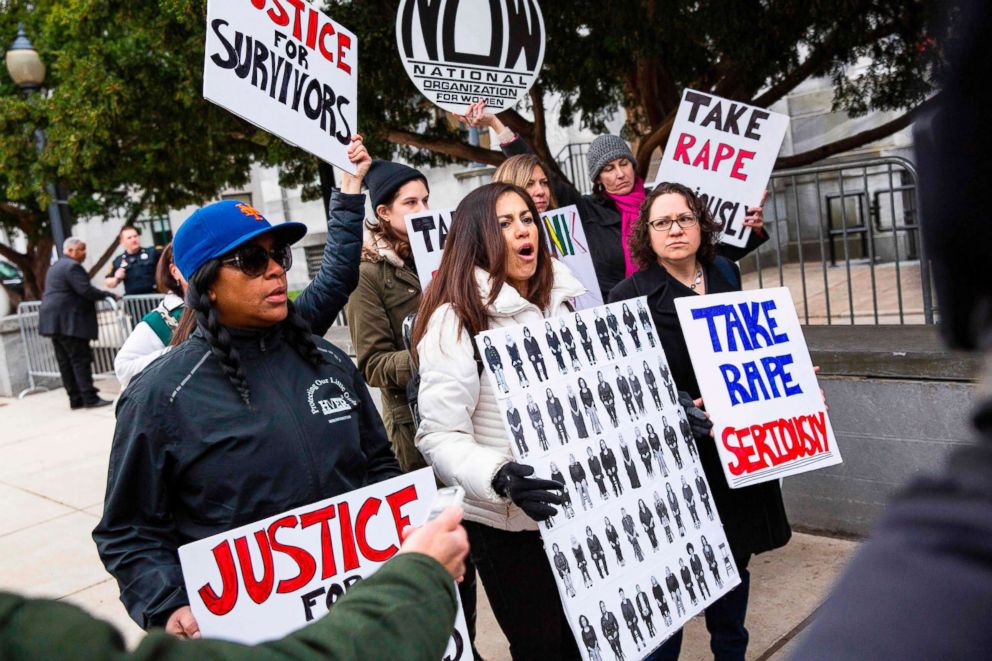 PHOTO: Protesters shout as Bill Cosby arrives for the first day of his second trial for sexual assault at the Montgomery County Courthouse in Norristown, Pa., April 9, 2018.