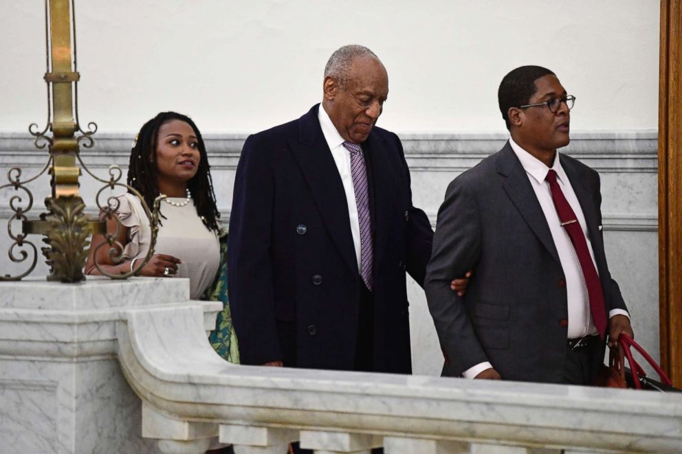 PHOTO: Bill Cosby, center, leaves with publicist Ebonee Benson, left, and spokesperson Andrew Wyatt for the day from his sexual assault trial at the Montgomery County Courthouse, April 18, 2018, in Norristown, Pa.