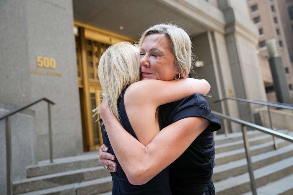 PHOTO: Amy Yoney, right, and Laurie Kanyok, left, embrace after speaking to members of the media during a break in sentencing proceedings for convicted sex offender Robert Hadden outside Federal Court, July 24, 2023, in New York.