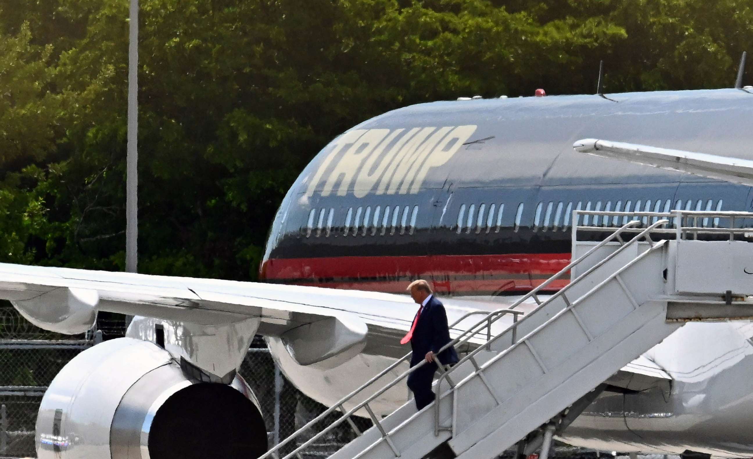 PHOTO: Former President Donald Trump disembarks "Trump Force One" at Miami International Airport in Miami, June 12, 2023.