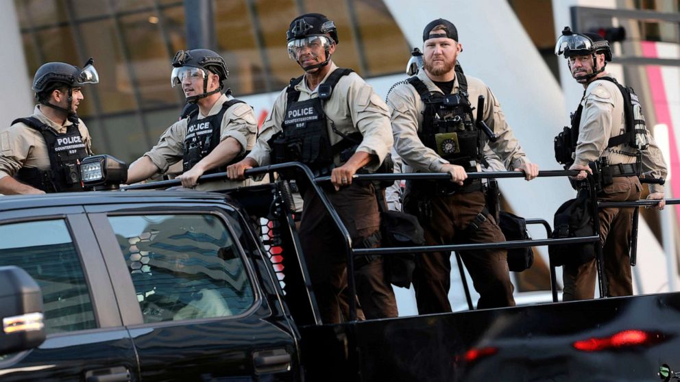 PHOTO: Members of law enforcement wearing riot gear ride past the Wilkie D. Ferguson, Jr. U.S. Courthouse, June 13, 2023 in Miami.