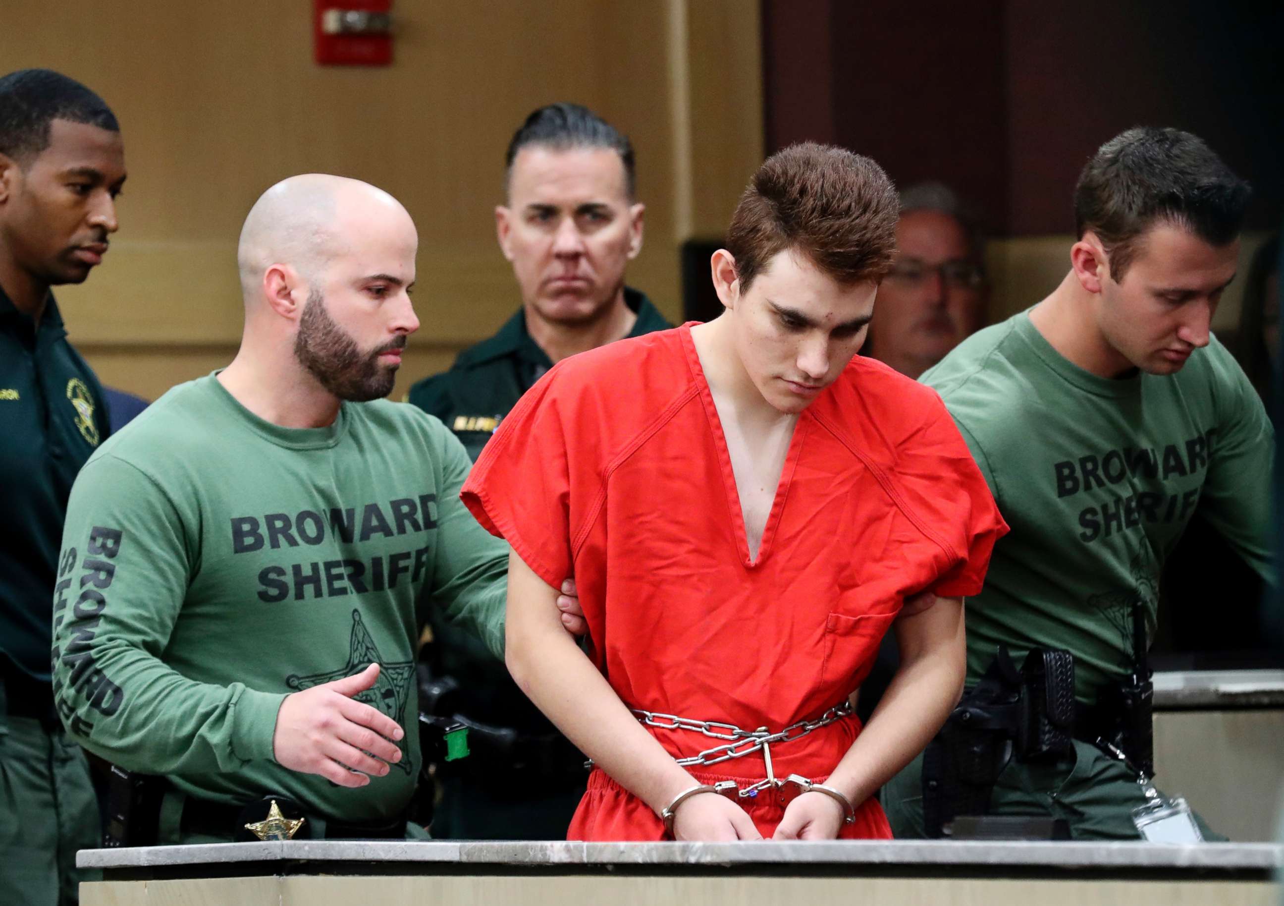 PHOTO: Nikolas Cruz is lead into the courtroom before being arraigned at the Broward County Courthouse in  Fort Lauderdale, Fla., March 14, 2018.