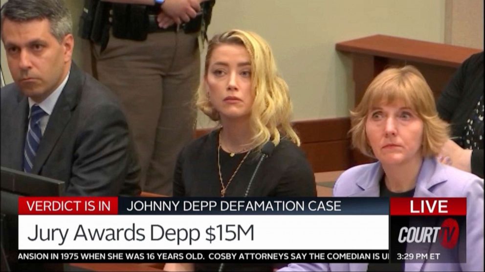 PHOTO: In this screen grab from video, Amber Heard, center, and her lawyers Elaine Bredehoft, right, and Ben Rottenborn, left, react as the verdict is read in the courtroom in the Fairfax County Circuit Courthouse in Fairfax, Va., on June 1, 2022.