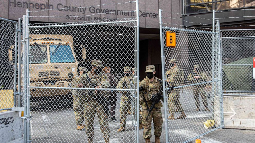 PHOTO: Members of the National Guard open the security gate outside the Hennepin County Government Center, March 9, 2021, in Minneapolis, during jury selection for the trial of former Minneapolis Police Department officer Derek Chauvin.