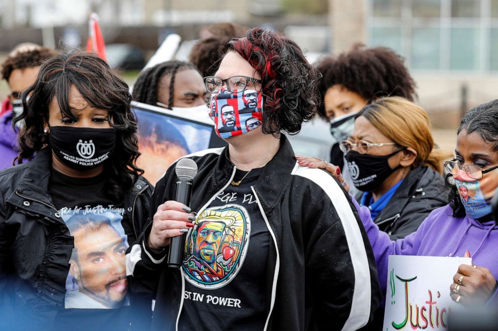 PHOTO: Courtney Ross, George Floyd's girlfriend, is comforted while speaking at a march hosted by Families Supporting Families Against Police Brutality, in St. Paul, Minn.,  April 11, 2021.