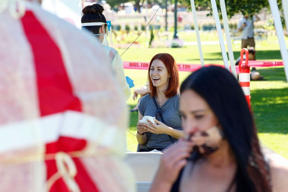 PHOTO: Aubrey Burgess reacts to getting swabbed for a coronavirus disease (COVID-19) test at a testing site set up at an event to mark Juneteenth in Denver, June 20, 2020. 