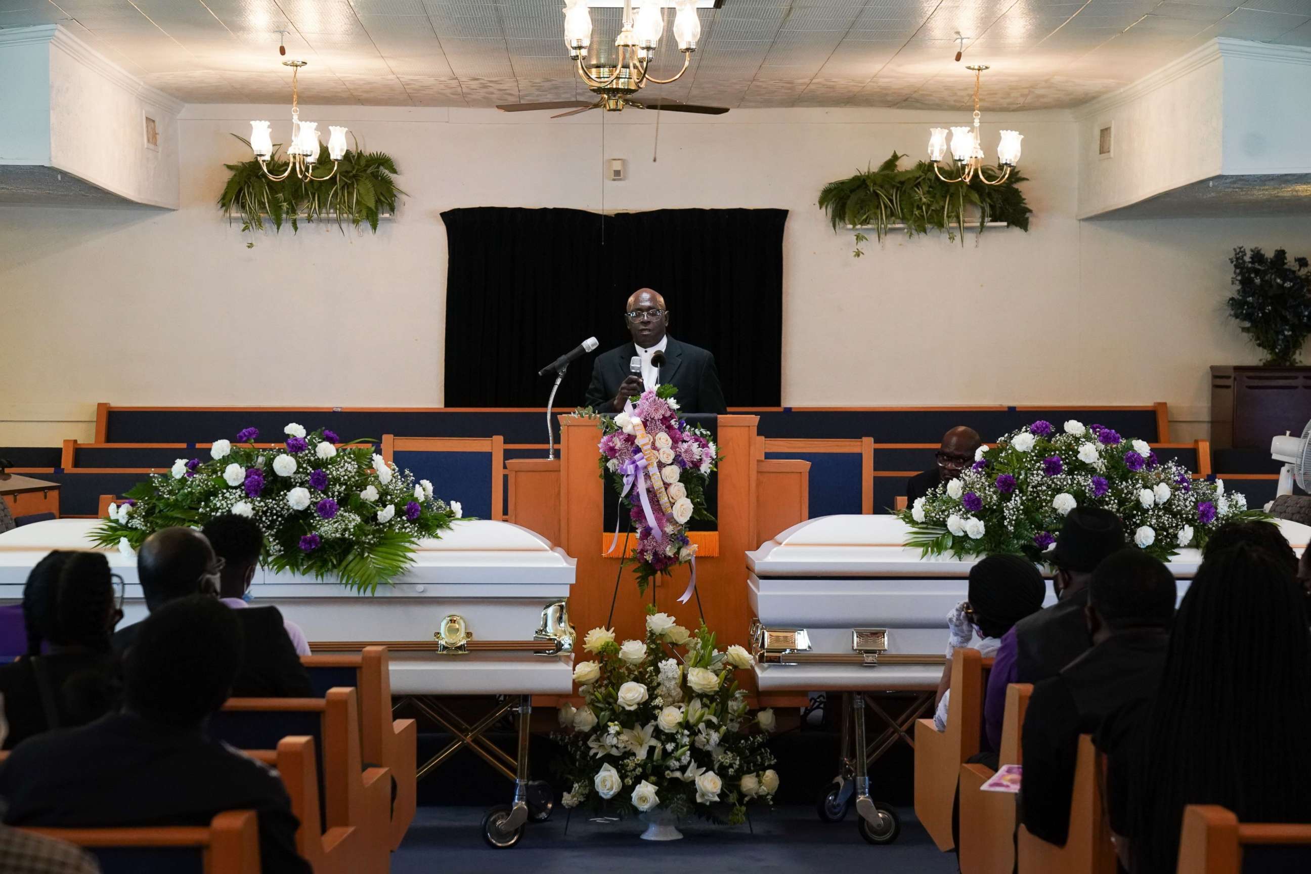 PHOTO: A Reverend speaks at a double funeral service for a mother and daughter who both died of coronavirus, at the Denley Drive Missionary Baptist church in Dallas, July 30, 2020.