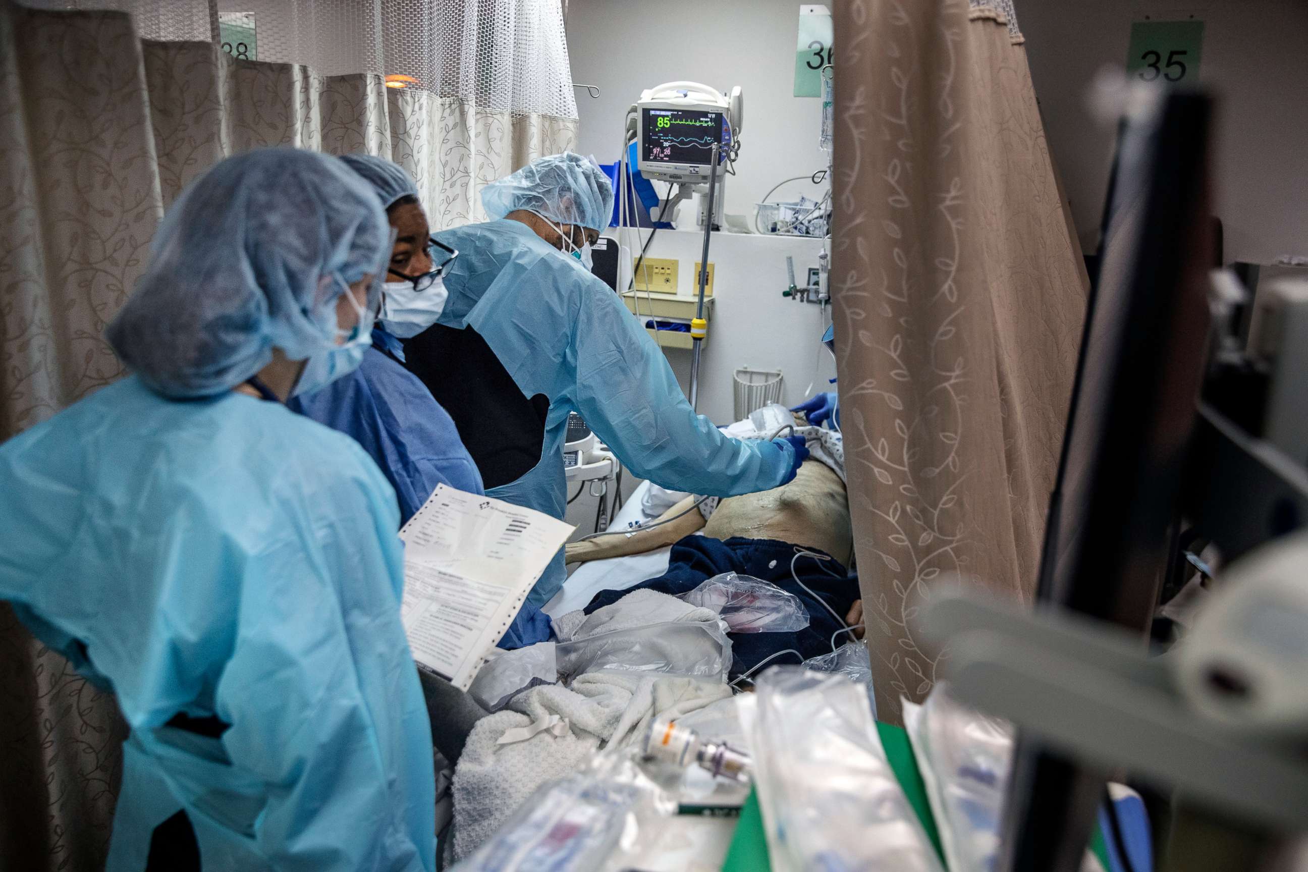 PHOTO: Medical staff treat a patient in a Covid-19 ward at the Brooklyn Hospital Center in New York on Monday, March 23, 2020.