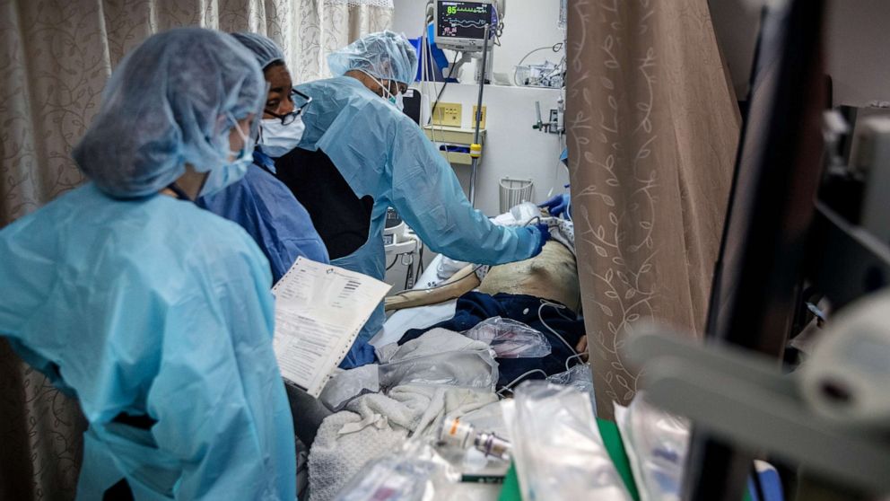 PHOTO: Medical staff treat a patient in a Covid-19 ward at the Brooklyn Hospital Center in New York on Monday, March 23, 2020.