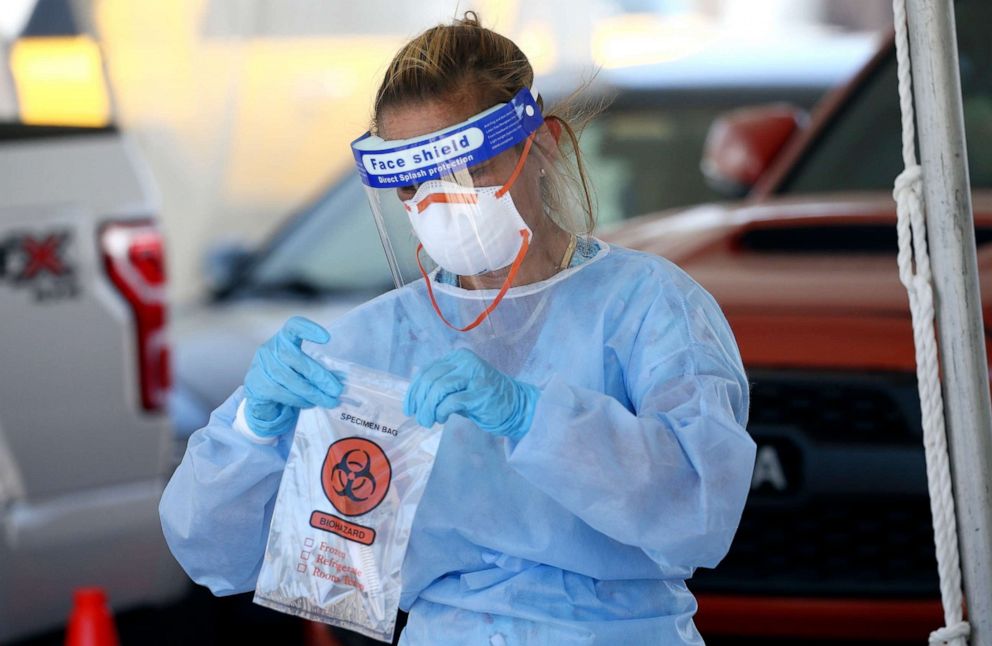 PHOTO: A specimen is secured at a drive-thru coronavirus testing site at South Mountain Community College, July 9, 2020, in Phoenix.