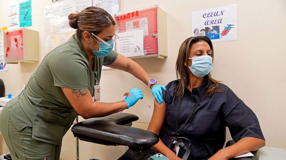 PHOTO: In this Nov. 1, 2022, file photo, a nurse vaccinates a woman with a fourth Pfizer COVID-19 vaccine booster at the Dr. Kenneth Williams Health Center in Los Angeles.