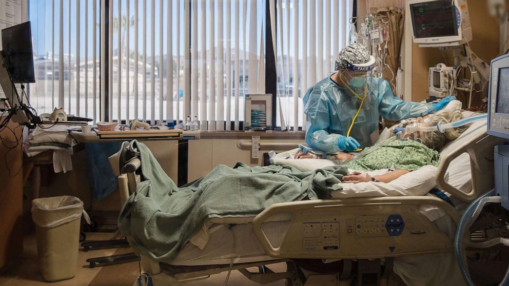 PHOTO: A Registered Nurse tends to a COVID-19 patient in the Intensive Care Unit at Providence St. Mary Medical Center in Apple Valley, Calif., Jan. 11, 2021. 