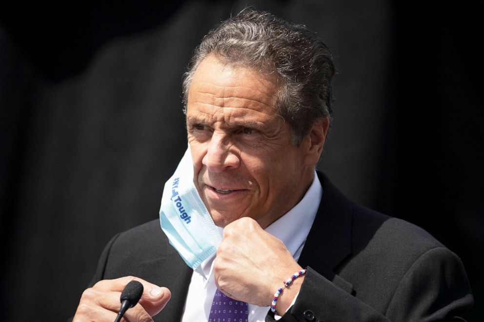 PHOTO: Gov. Andrew Cuomo removes a mask as he holds a news conference in Tarrytown, N.Y., June 15, 2020.