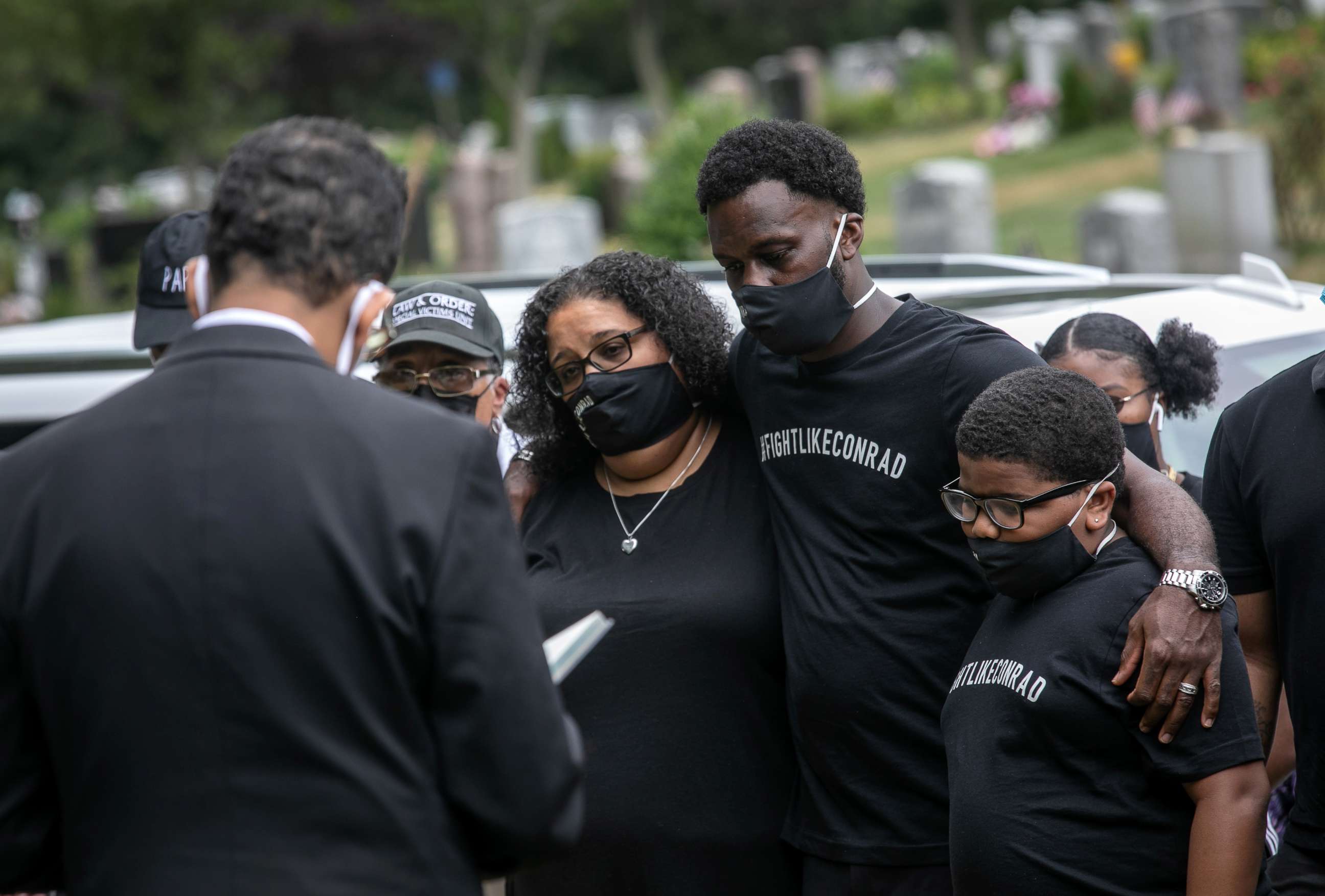 PHOTO: Maryann Coleman mourns with family and friends during the burial of her husband Conrad Coleman Jr. on July 3, 2020 in Rye, N.Y. Coleman, 39, died of COVID-19 on June 20, 2020, just over two months after his father also died of the disease.