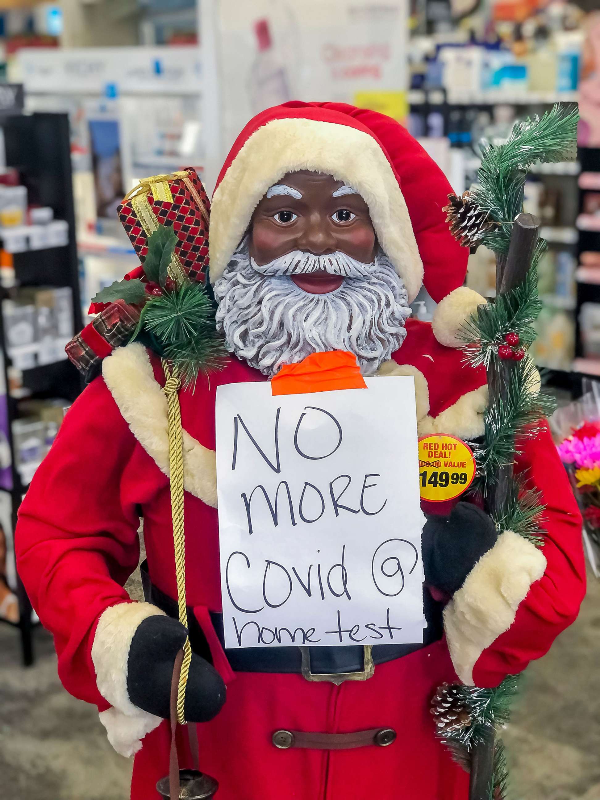 PHOTO: A Santa Claus on display at the entrance to a CVS Pharmacy announces the store has no more at-home COVID-19 test in Decatur, Ga., Dec. 20, 2021.