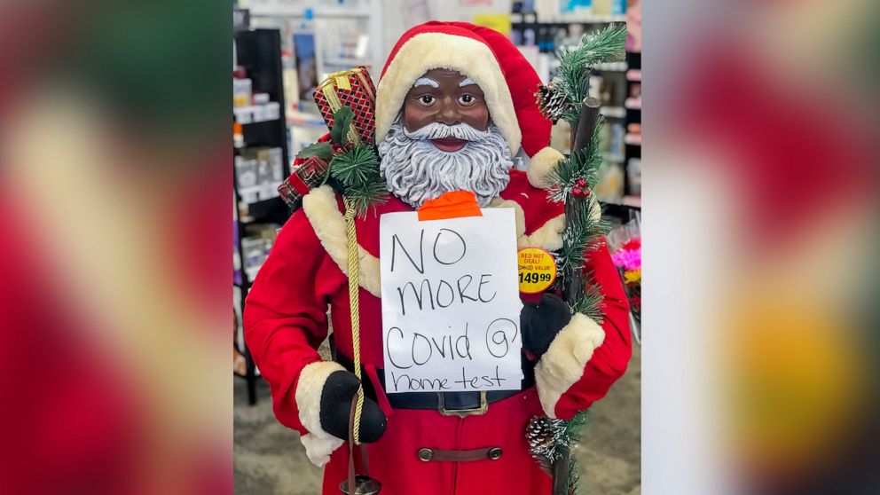PHOTO: A Santa Claus on display at the entrance to a CVS Pharmacy announces the store has no more at-home COVID-19 test in Decatur, Ga., Dec. 20, 2021.