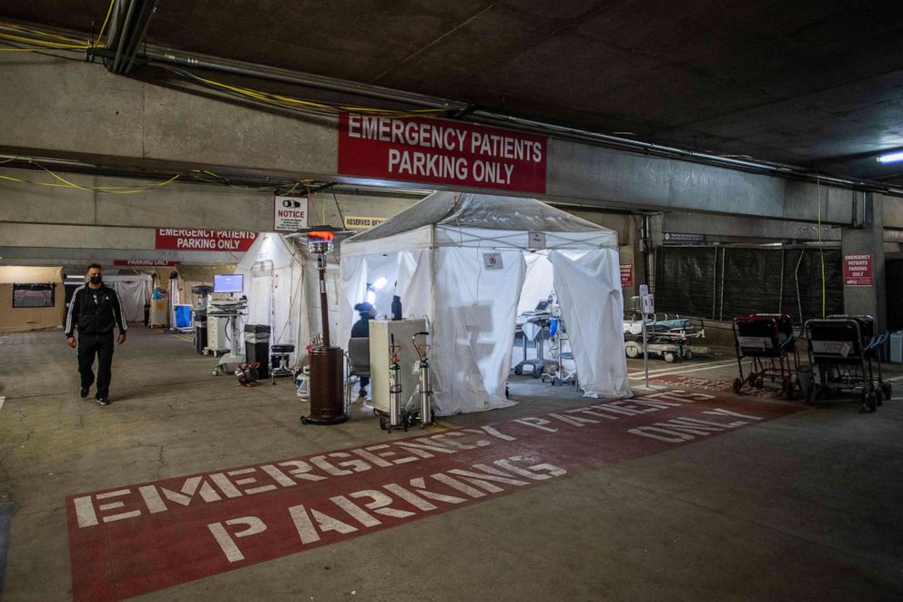 PHOTO: Medical Director of the Intensive Care Unit (ICU) Dr. Thomas Yadegar walks inside a temporary Emergency Room, built into a parking garage at Providence Cedars-Sinai Tarzana Medical Center in Tarzana, Calif., Jan. 3, 2021.