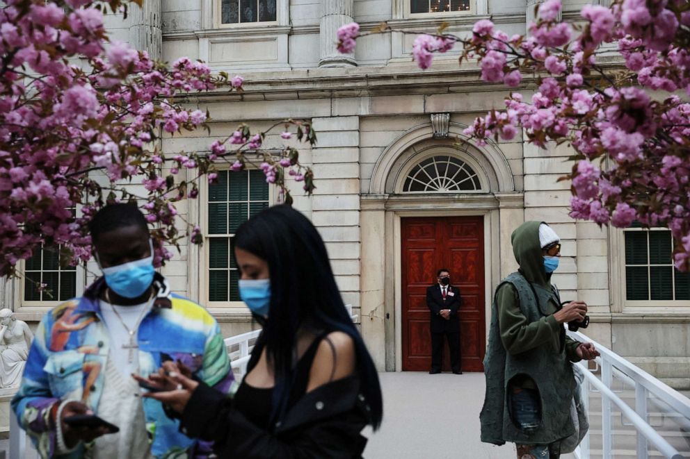 PHOTO: A security guard wearing a protective face mask stands with others during the press preview of "In America: An Anthology of Fashion", ahead of the Met Gala at the Metropolitan Museum of Art in New York, on May 2, 2022.