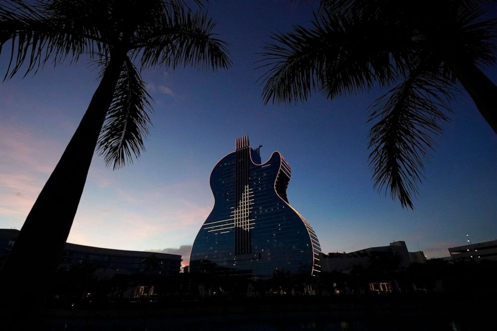 PHOTO: Doves are illuminated in LED lights on the side of The Guitar Hotel at Seminole Hard Rock Hotel & Casino Hollywood, Jan. 19, 2021, in Hollywood, Fla.