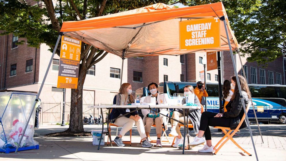 PHOTO: Volunteer students from the College of Nursing wait for stadium workers to get screened for Covid-19 symptoms before entering Neyland Stadium to work in Knoxville, Tenn., Oct. 3, 2020.