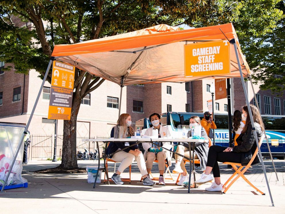 PHOTO: Volunteer students from the College of Nursing wait for stadium workers to get screened for Covid-19 symptoms before entering Neyland Stadium to work in Knoxville, Tenn., Oct. 3, 2020.