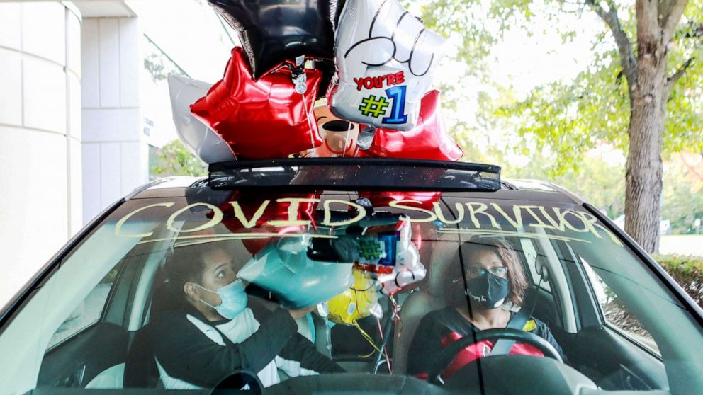 PHOTO: Demetrius Booker, who spent 94 days in the hospital after battling COVID-19, sits inside a balloon-filled car driven by sister Latosha Booker Bishop as he prepares to go home after his release from Louisville Baptist East in Ky., Oct. 23, 2020.
