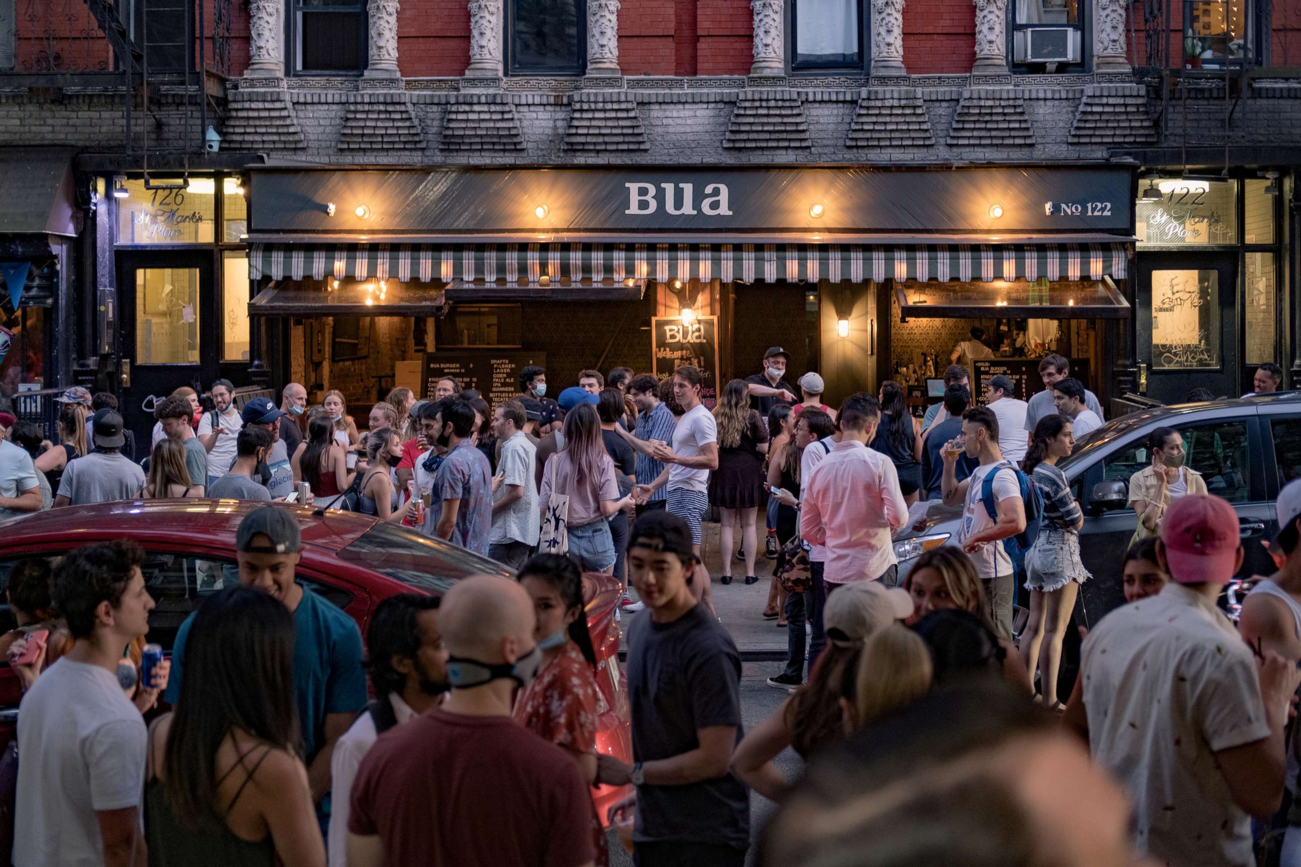 PHOTO: People drink outside a bar during the reopening phase following the coronavirus disease (COVID-19) outbreak in the East Village neighborhood in New York City, June 12, 2020.