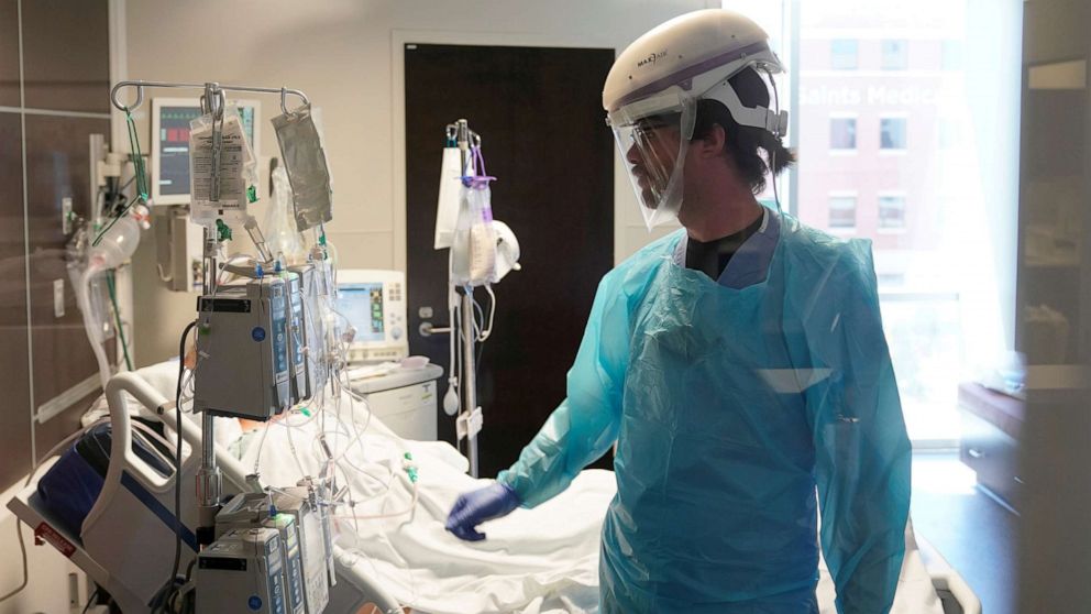 PHOTO: A nurse works in a COVID-19 patient's room in the SSM Health St. Anthony Hospital's intensive care unit in Oklahoma City, Aug. 24, 2021.