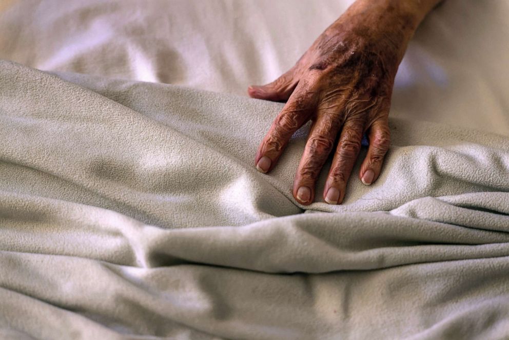 PHOTO: A Covid positive man, 83, lies in bed before being transported to a hospital, Sept. 13, 2021 in Houston, Texas.