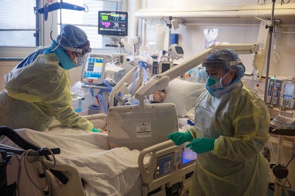 PHOTO: Two nurses assess the breathing ability of a COVID-19 patient using oxygen on the Intensive Care Unit (ICU) floor at the Veterans Affairs Medical Center on April 21, 2020 in Brooklyn, New York City.