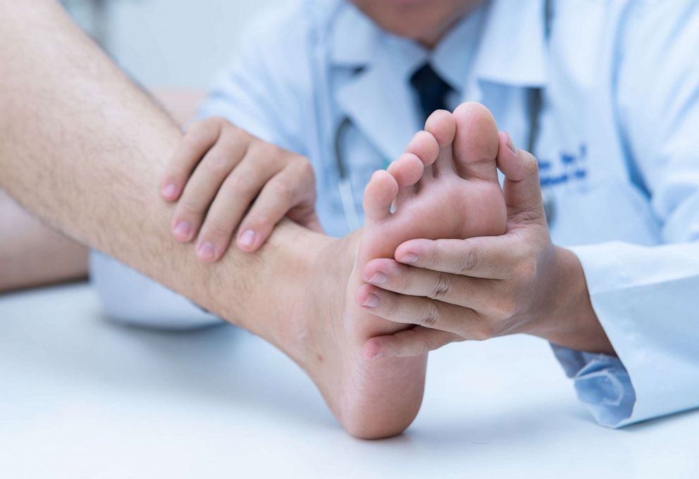 PHOTO: A dermatologist examines a patient's foot in this undated file image.