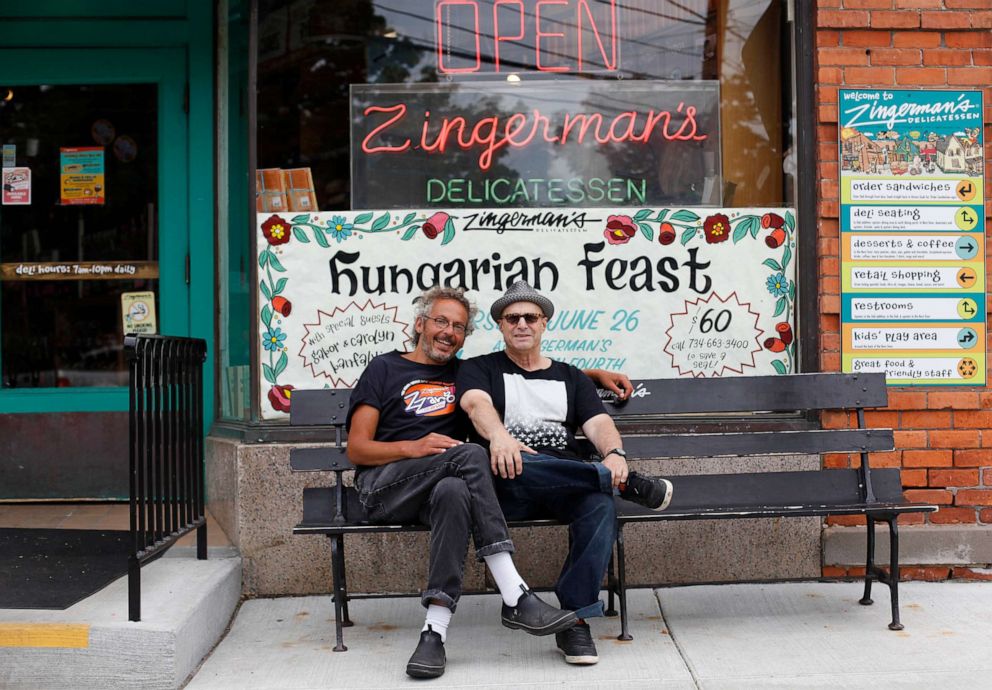 PHOTO: Ari Weinzweig, cofounder of the Zingerman's Community of Businesses of Ann Arbor, Mich., is pictured, left, in 2014 with Paul Saginaw in front of Zingerman's Deli.