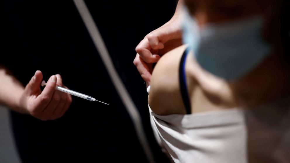 PHOTO: A medical worker administers a dose of the Covid-19 vaccine in a vaccination center in Saint-Nazaire, France, May 28, 2021.