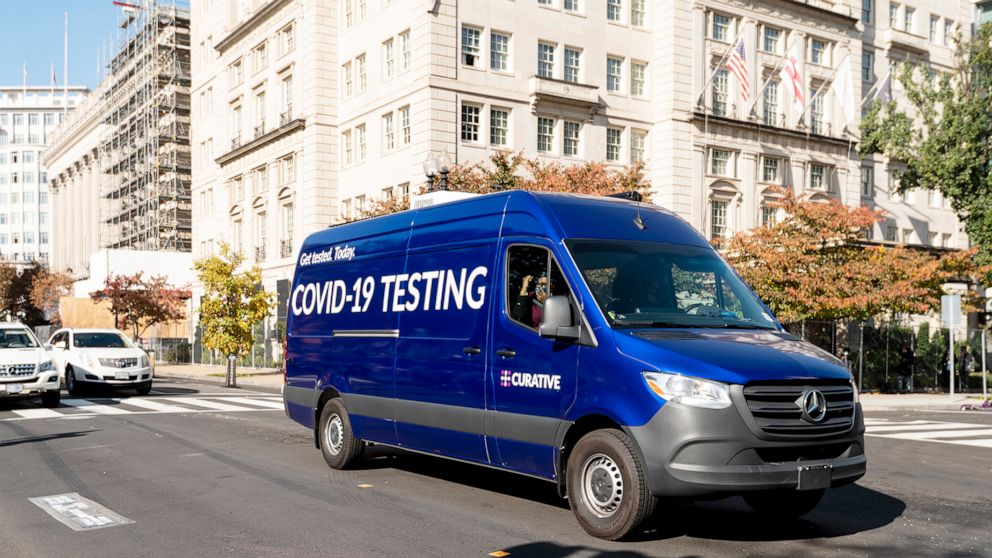PHOTO: A Curative mobile COVID-19 testing van drives down H Street in front of the White House in Washington on Friday morning, Nov. 6, 2020. 
